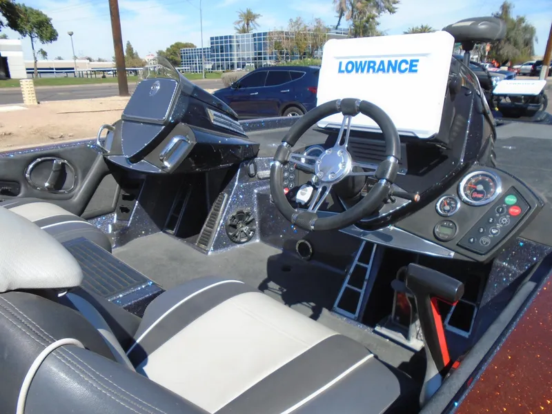 Slide: The Image of 2015 Ranger Z521 Comanche boat interior with Lowrance electronics and steering wheel. - 15