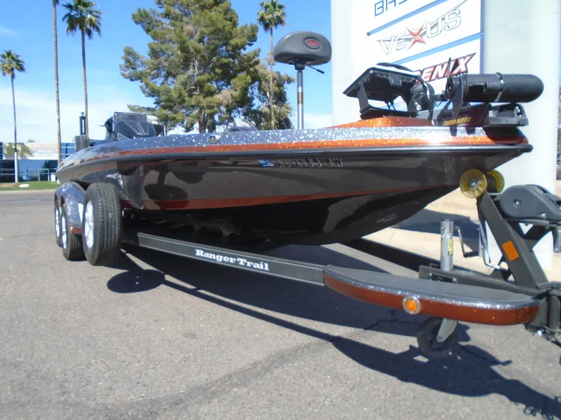 Slide: The Image of 2015 Ranger Z521 Comanche boat on trailer, parked outdoors with palm trees in background. - 20