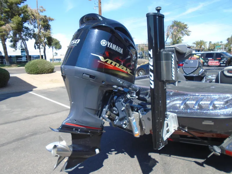 Slide: The Image of 2015 Ranger Z521 Comanche with Yamaha VMAX outboard motor in a parking lot. - 5