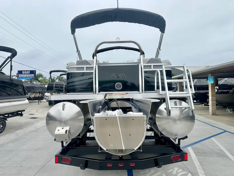 Slide: The Image of 2025 Avalon 23' Venture Quad Lounger with 150HP Mercury, showcased at a boat showroom. - 10