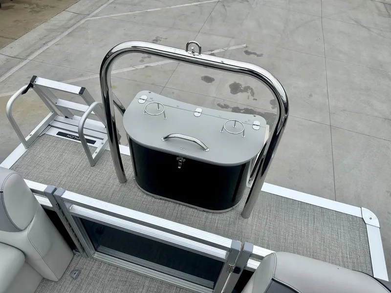 Slide: The Image of 2025 Avalon 23' Venture Quad Lounger boat with sleek deck and modern railing design. - 11