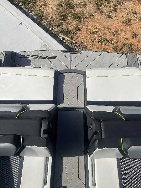 Slide: The Image of 2021 Yamaha Boats 255X interior seating with sleek design and modern upholstery. - 11