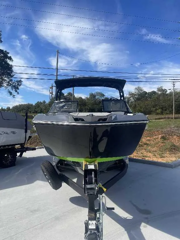 Slide: The Image of 2021 Yamaha Boats 255X on trailer under clear blue sky. - 16