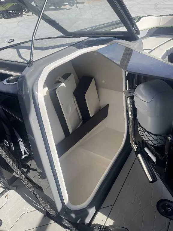 Slide: The Image of Storage compartment of a 2021 Yamaha Boats 255X, showcasing interior space and design. - 2