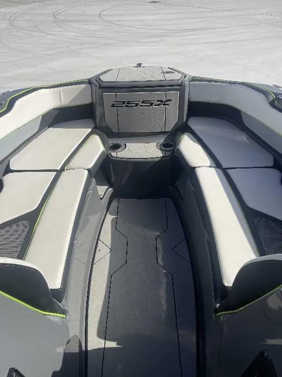 Slide: The Image of 2021 Yamaha Boats 255X interior with cushioned seating and sleek design. - 3