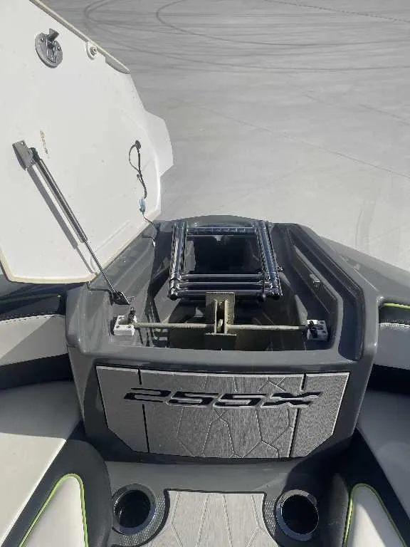 Slide: The Image of 2021 Yamaha Boats 255X open storage compartment with sleek design and modern features. - 5