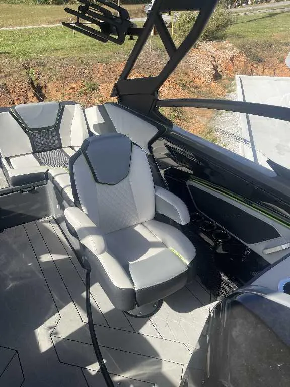 Slide: The Image of Interior of 2021 Yamaha Boats 255X, featuring sleek seating and modern design elements. - 6