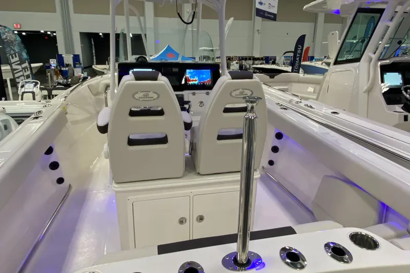 Slide: The Image of 2024 Sailfish 242 CC boat interior with dual seats and modern dashboard. - 5