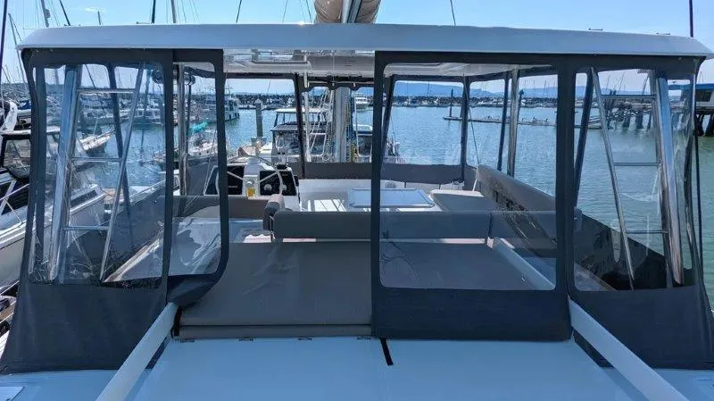 Slide: The Image of 2022 Bali 4.6 yacht with enclosed deck, docked at marina. - 10