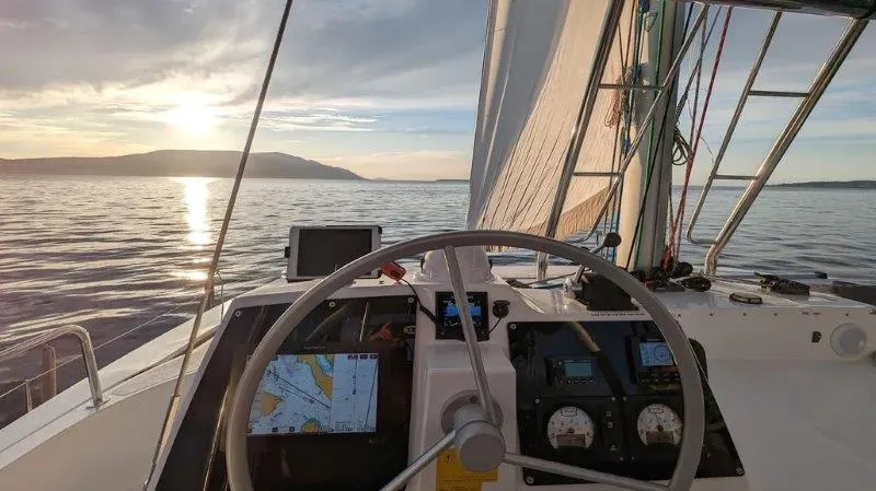 Slide: The Image of Sailing on a Bali 4.6 yacht at sunset, 2022 model, with navigational equipment visible. - 11