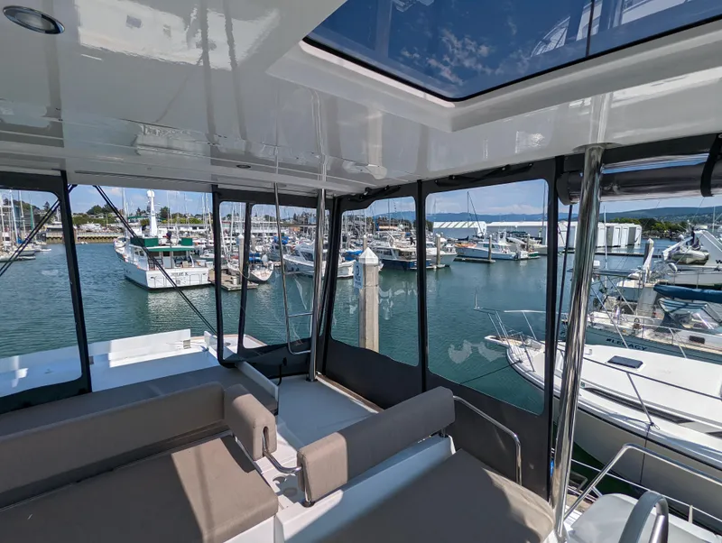 Slide: The Image of Luxurious Bali 4.6 catamaran interior with marina view, 2022 model. - 13