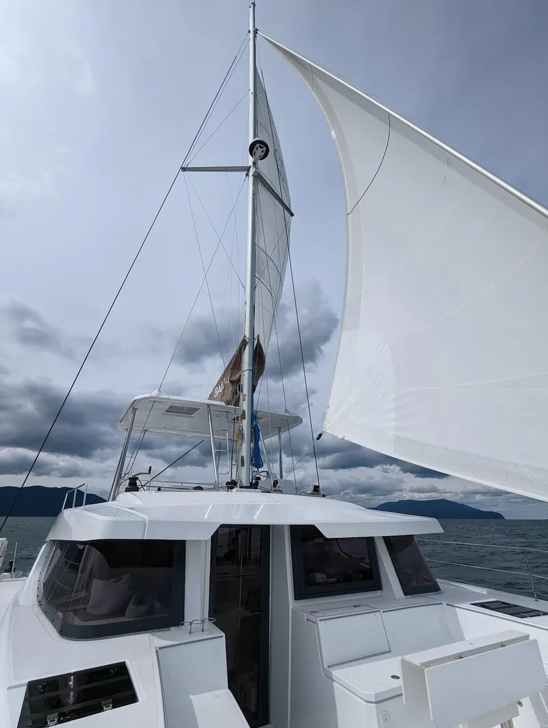 Slide: The Image of 2022 Bali 4.6 yacht sailing under cloudy skies with full sails. - 18