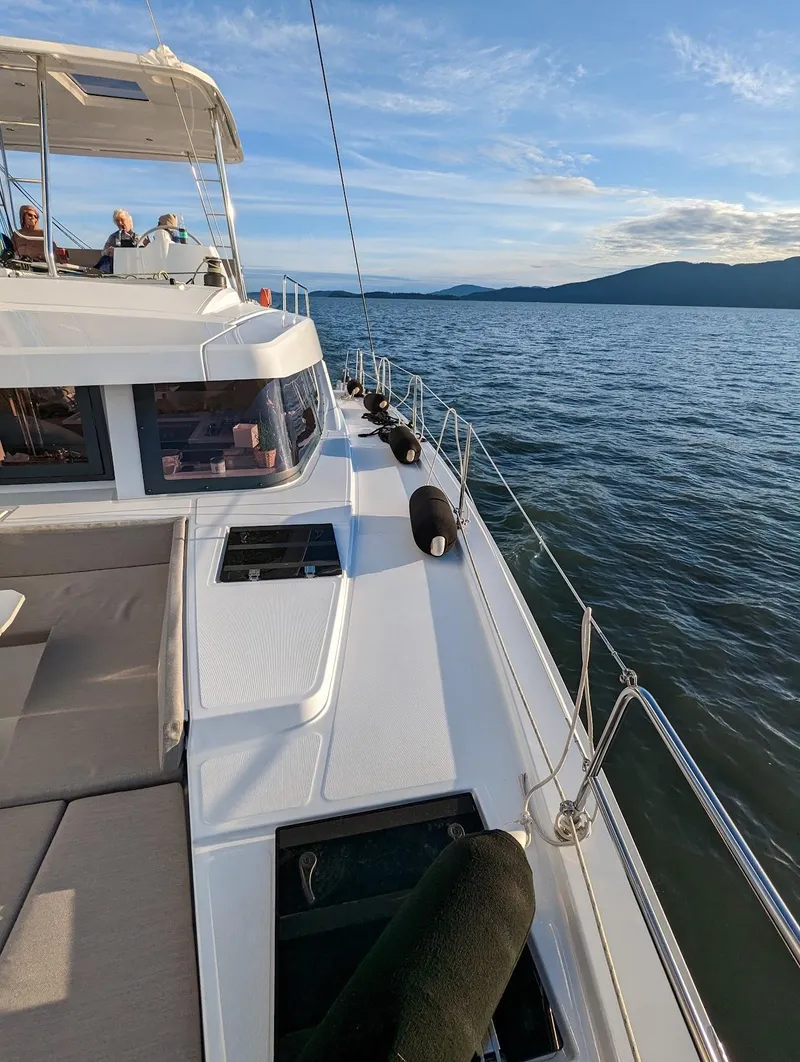 Slide: The Image of 2022 Bali 4.6 yacht sailing on calm waters under a clear blue sky. - 20