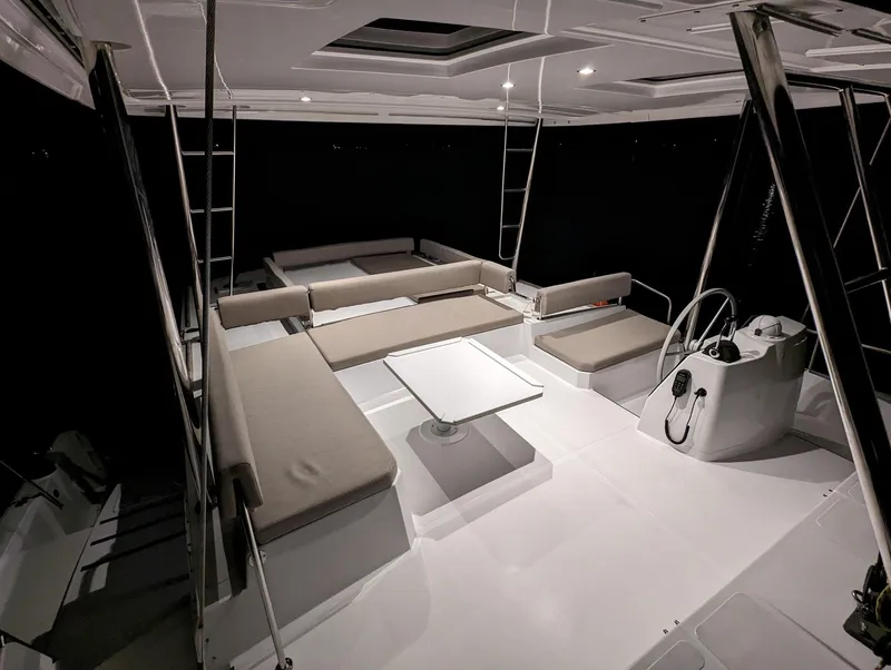 Slide: The Image of Spacious interior of 2022 Bali 4.6 catamaran with seating and helm station. - 26