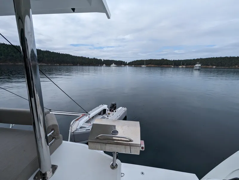 Slide: The Image of Bali 4.6 yacht on calm water with scenic forested shoreline, 2022 model. - 30