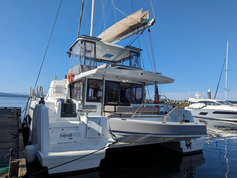 Slide: The Image of 2022 Bali 4.6 catamaran docked at marina under clear blue sky. - 31