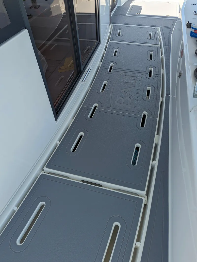 Slide: The Image of Deck of Bali 4.6 yacht, 2022 model, featuring sleek gray panels and modern design. - 34