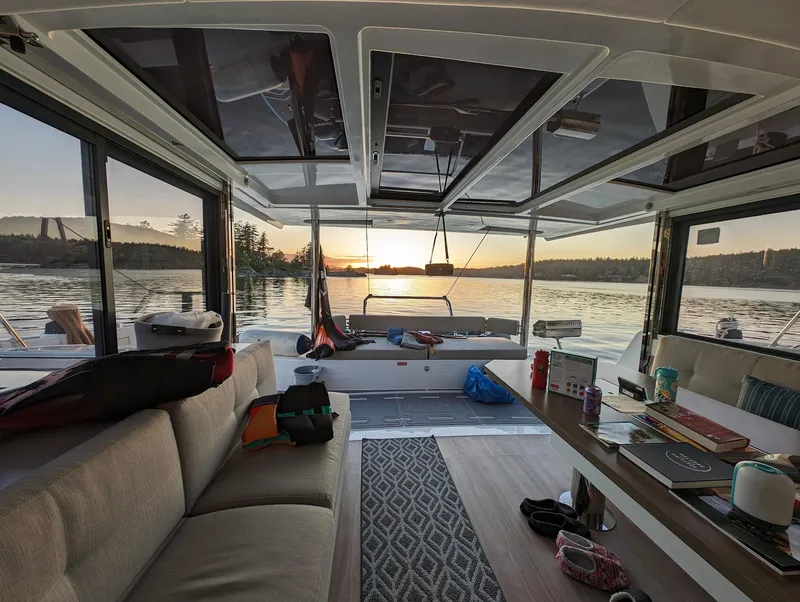 Slide: The Image of Interior of 2022 Bali 4.6 catamaran with sunset view over water. - 35