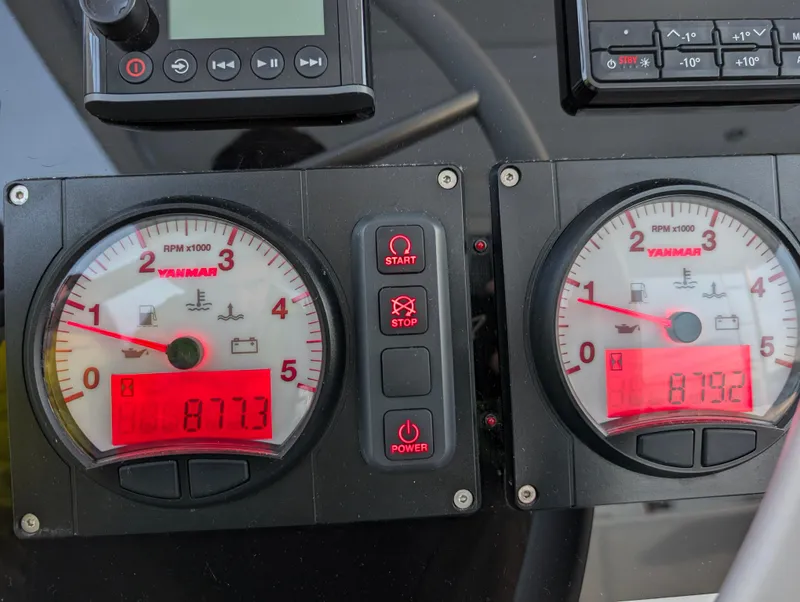 Slide: The Image of Close-up of Bali 4.6 yacht's dual engine gauges, displaying RPM and engine hours. - 40
