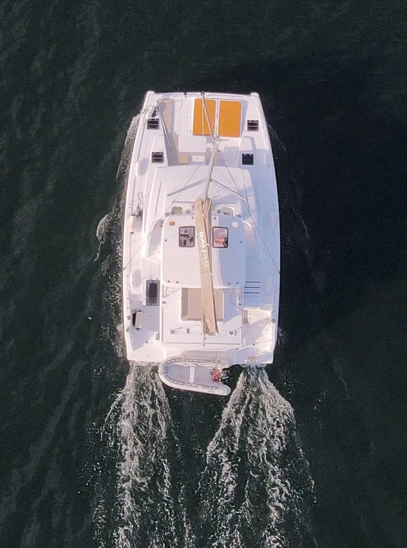 Slide: The Image of Aerial view of 2022 Bali 4.6 catamaran sailing on open water. - 41