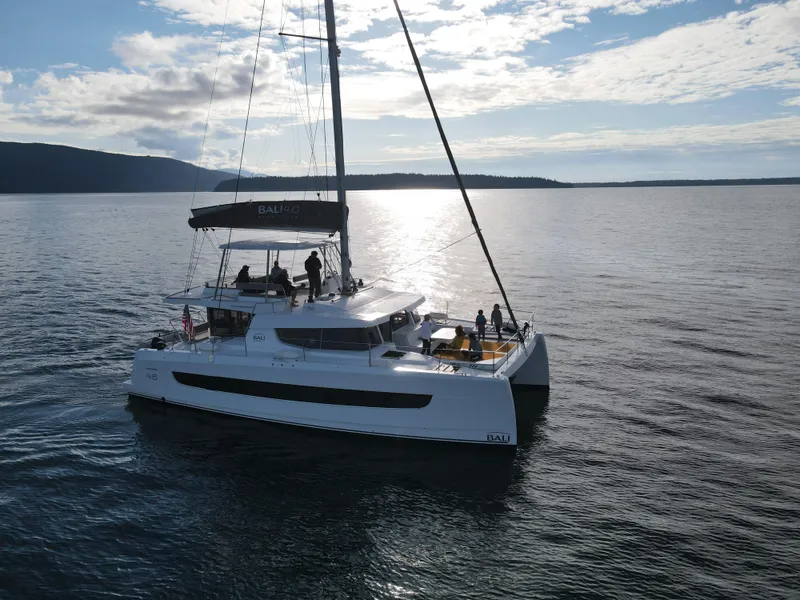 Slide: The Image of Sailing catamaran Bali 4.6, 2022 model, cruising on calm waters under a partly cloudy sky. - 42