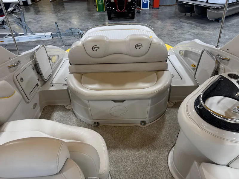 Slide: The Image of 2007 Crownline 320LS boat interior with white seating and modern design. - 11