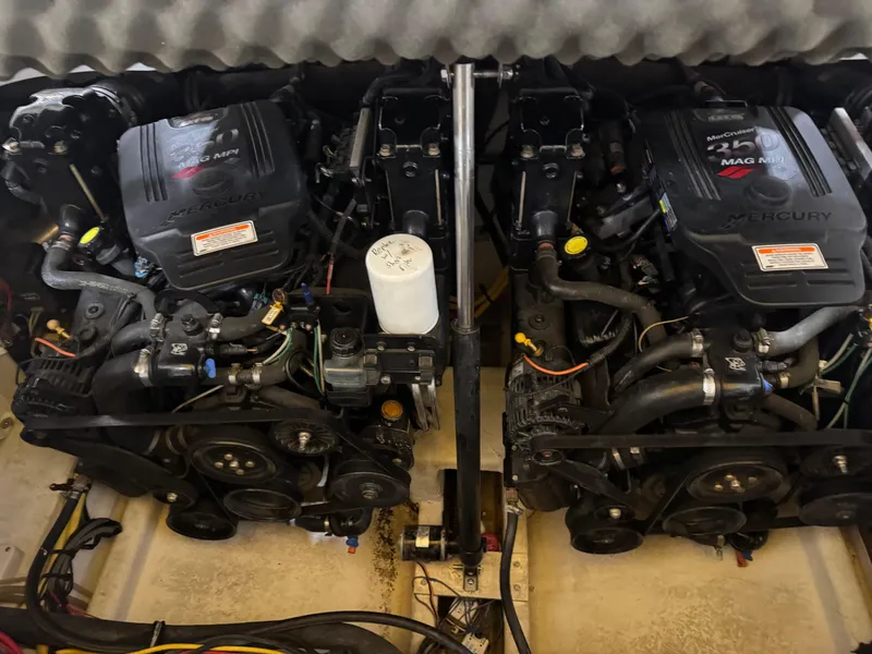 Slide: The Image of Twin engines of a 2007 Crownline 320LS boat, showcasing detailed mechanical components. - 21