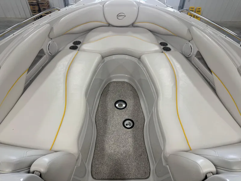 Slide: The Image of 2007 Crownline 320LS boat interior with white seating and carpeted floor. - 9