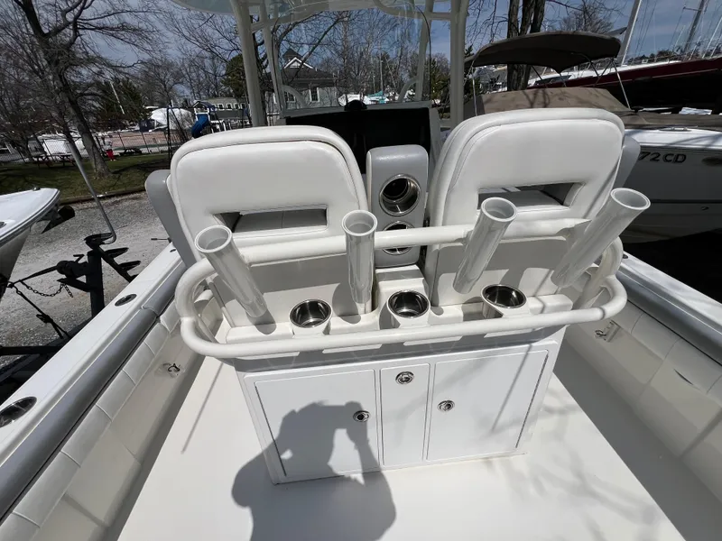 Slide: The Image of 2019 Regulator 28 boat interior with rod holders and storage compartments. - 14