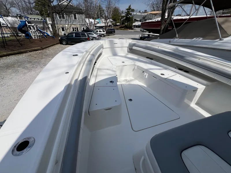 Slide: The Image of 2019 Regulator 28 boat interior with seating and storage compartments. - 23
