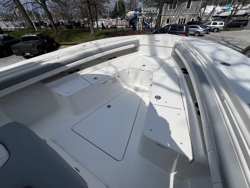 Slide: The Image of 2019 Regulator 28 boat interior with spacious seating and storage compartments. - 24