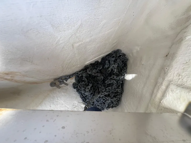 Slide: The Image of Coiled anchor chain in a 2019 Regulator 28 boat compartment. - 27