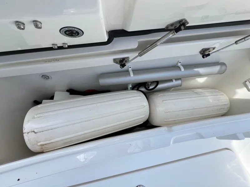 Slide: The Image of Storage compartment of a 2019 Regulator 28 boat with fenders and equipment. - 33