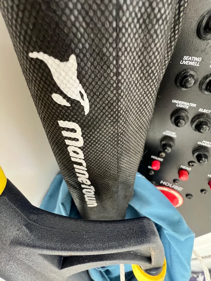 Slide: The Image of Close-up of a 2019 Regulator 28 boat control panel with Marinetown branding. - 40