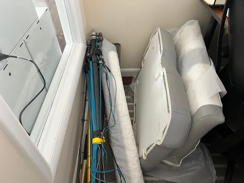 Slide: The Image of Stored boat cushions and fishing rods from a 2019 Regulator 28. - 42