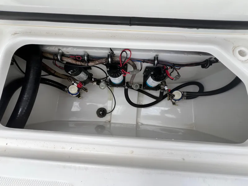 Slide: The Image of 2020 Sea Hunt Gamefish 27 Forward Seating boat wiring and plumbing compartment. - 11