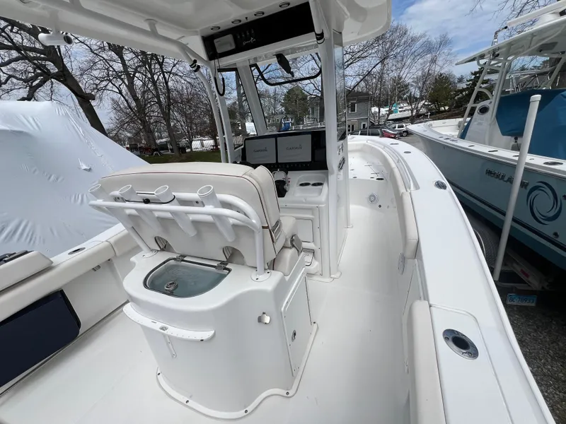 Slide: The Image of 2020 Sea Hunt Gamefish 27 boat interior with forward seating and navigation equipment. - 12