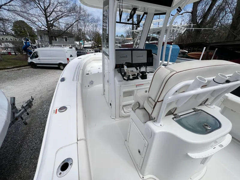 Slide: The Image of 2020 Sea Hunt Gamefish 27 boat with forward seating and modern helm controls. - 13