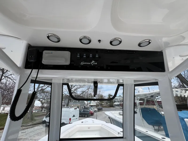 Slide: The Image of 2020 Sea Hunt Gamefish 27 console with Garmin electronics and forward seating view. - 15