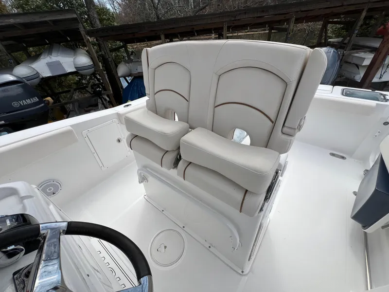Slide: The Image of 2020 Sea Hunt Gamefish 27 boat with forward seating and steering wheel. - 17