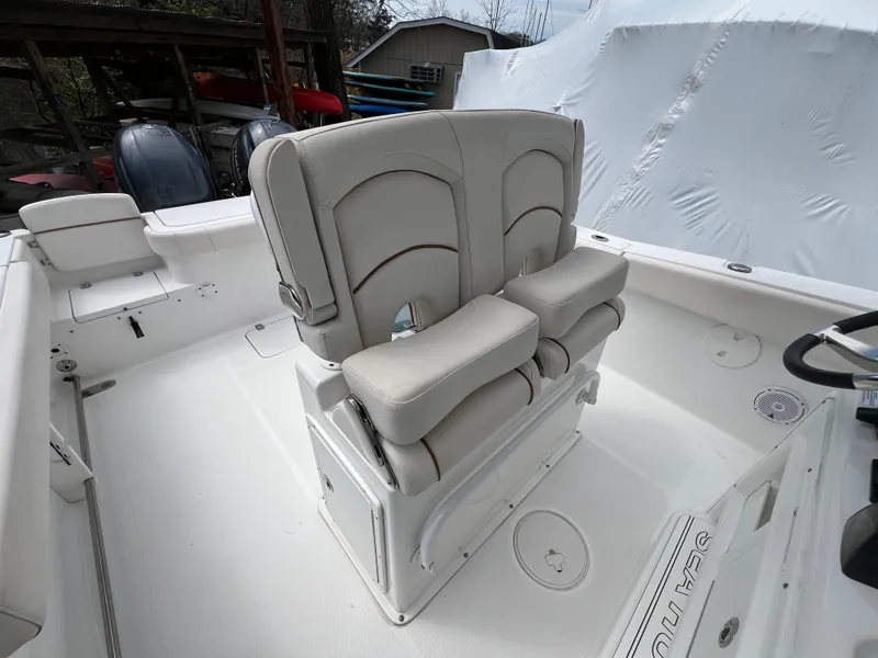 Slide: The Image of 2020 Sea Hunt Gamefish 27 boat with forward seating and dual helm chairs. - 18