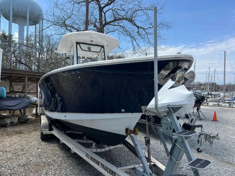 Slide: The Image of 2020 Sea Hunt Gamefish 27 boat on trailer, parked outdoors near marina. - 2