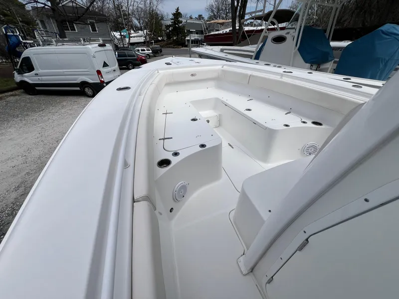 Slide: The Image of 2020 Sea Hunt Gamefish 27 Forward Seating boat interior, showcasing spacious seating and storage. - 20