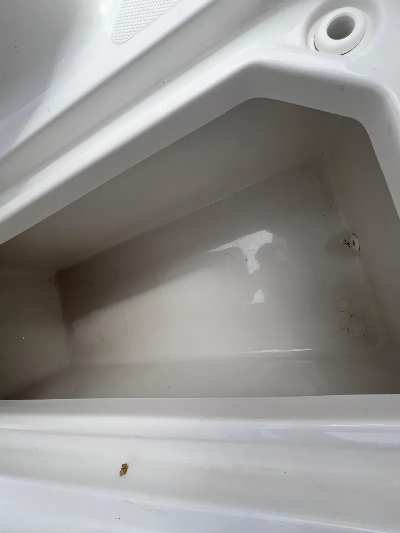 Slide: The Image of 2020 Sea Hunt Gamefish 27 Forward Seating storage compartment, clean and spacious interior. - 21