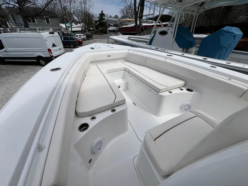 Slide: The Image of 2020 Sea Hunt Gamefish 27 Forward Seating, spacious white interior with cushioned seats. - 30