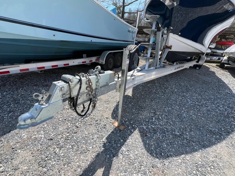Slide: The Image of 2020 Sea Hunt Gamefish 27 on trailer, gravel lot, close-up of hitch and bow. - 33