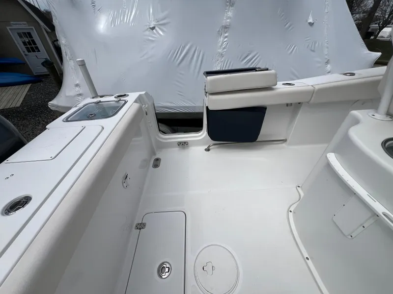 Slide: The Image of 2020 Sea Hunt Gamefish 27 boat interior with forward seating and storage compartments. - 9