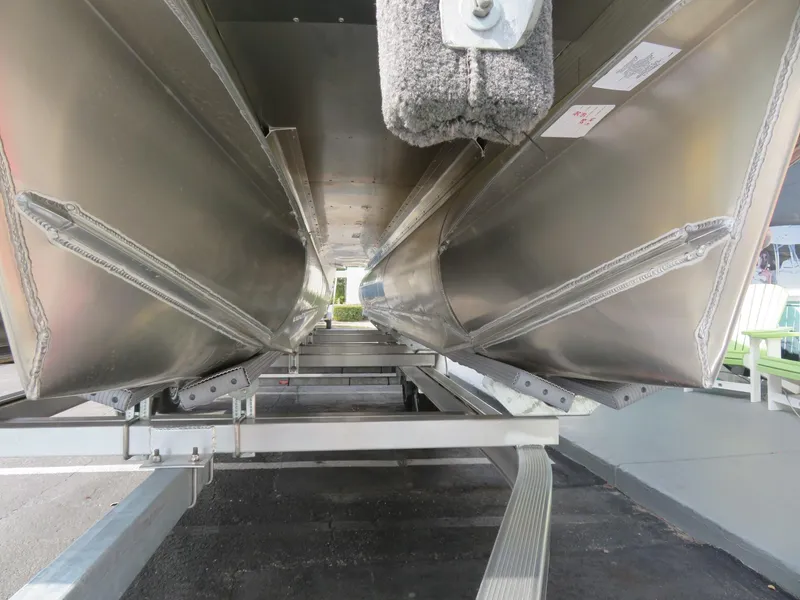 Slide: The Image of Underneath view of 2025 Avalon LSZ Quad Lounger pontoon boat on trailer. - 13