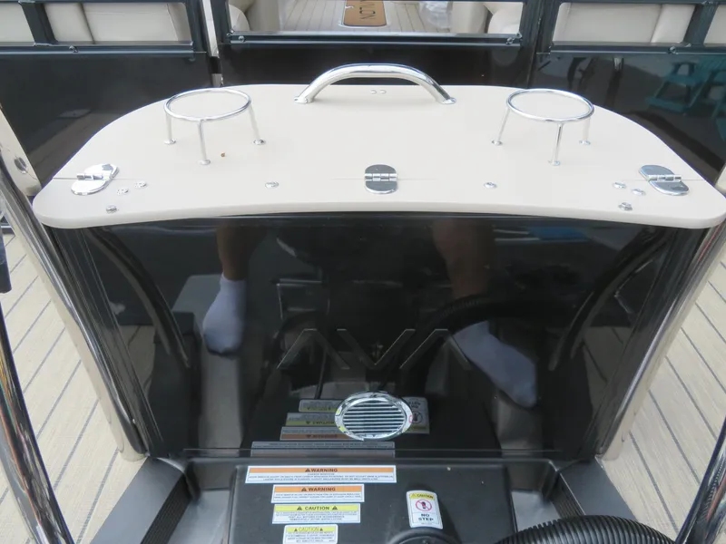 Slide: The Image of 2025 Avalon LSZ Quad Lounger dashboard with cup holders and control panel. - 16