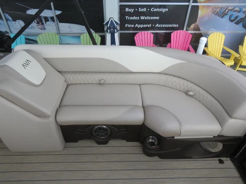Slide: The Image of 2025 Avalon LSZ Quad Lounger with beige seating and colorful chairs in the background. - 19
